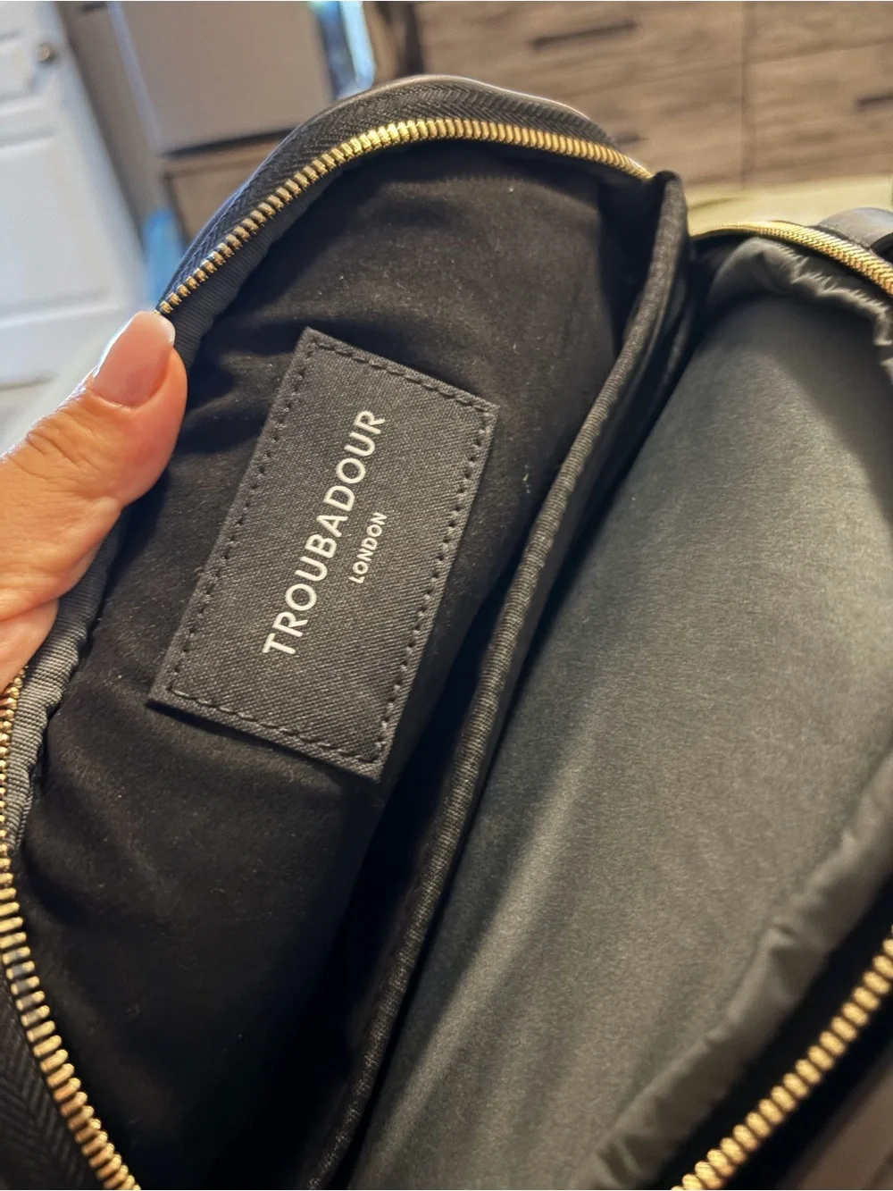 Sophisticated Black Women's Backpack with Gold Hardware
